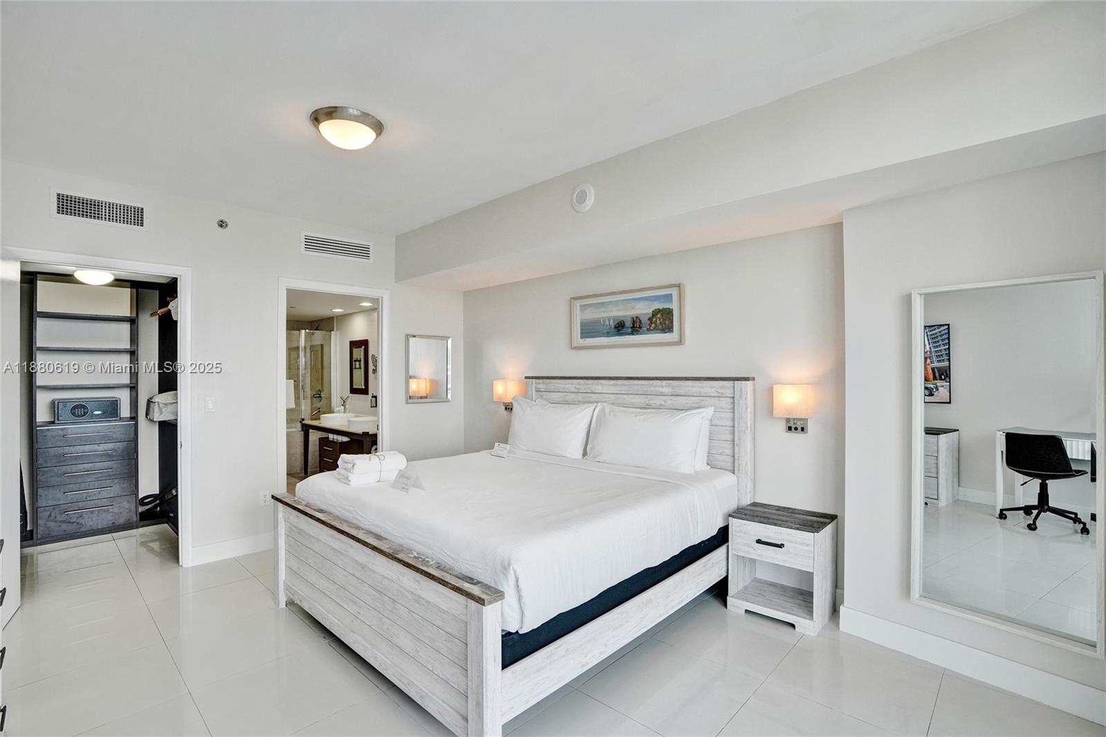 485 Brickell Avenue, Unit 4207 Miami, FL 33131 - Photo 13 of 41 a bedroom with a bed and a desk