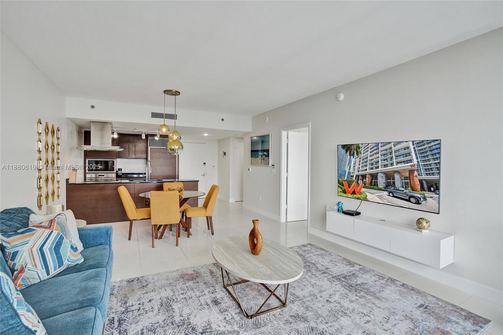 485 Brickell Avenue, Unit 4207 Miami, FL 33131 - Photo 2 of 41 a living room with furniture and a rug