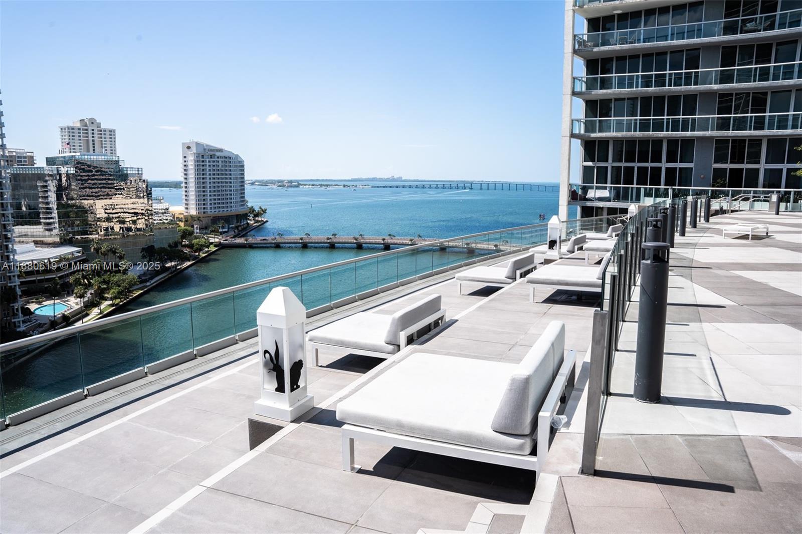 485 Brickell Avenue, Unit 4207 Miami, FL 33131 - Photo 38 of 41 a view of a balcony with two chairs and a table
