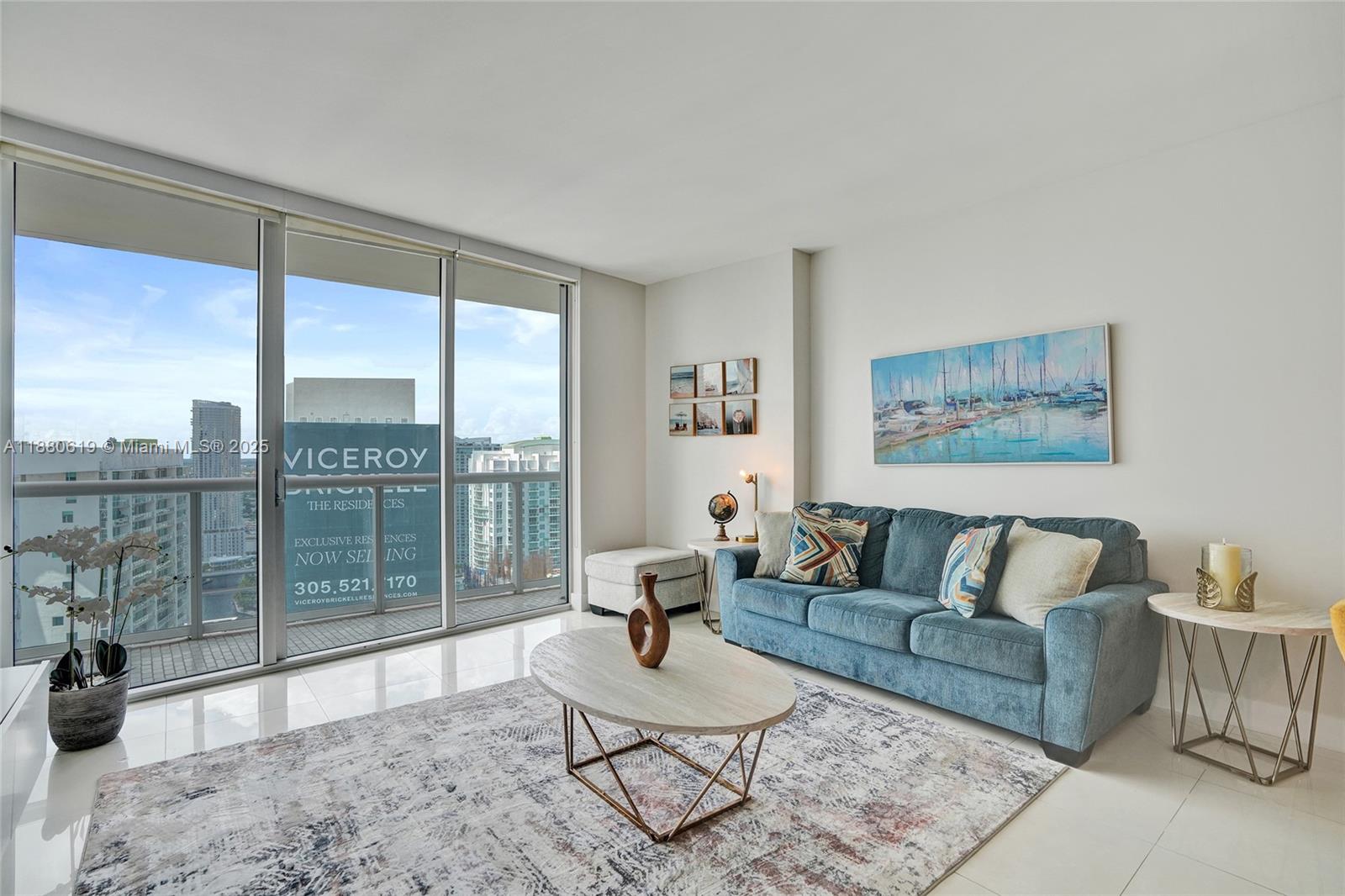 485 Brickell Avenue, Unit 4207 Miami, FL 33131 - Photo 4 of 41 a living room with furniture and a floor to ceiling window