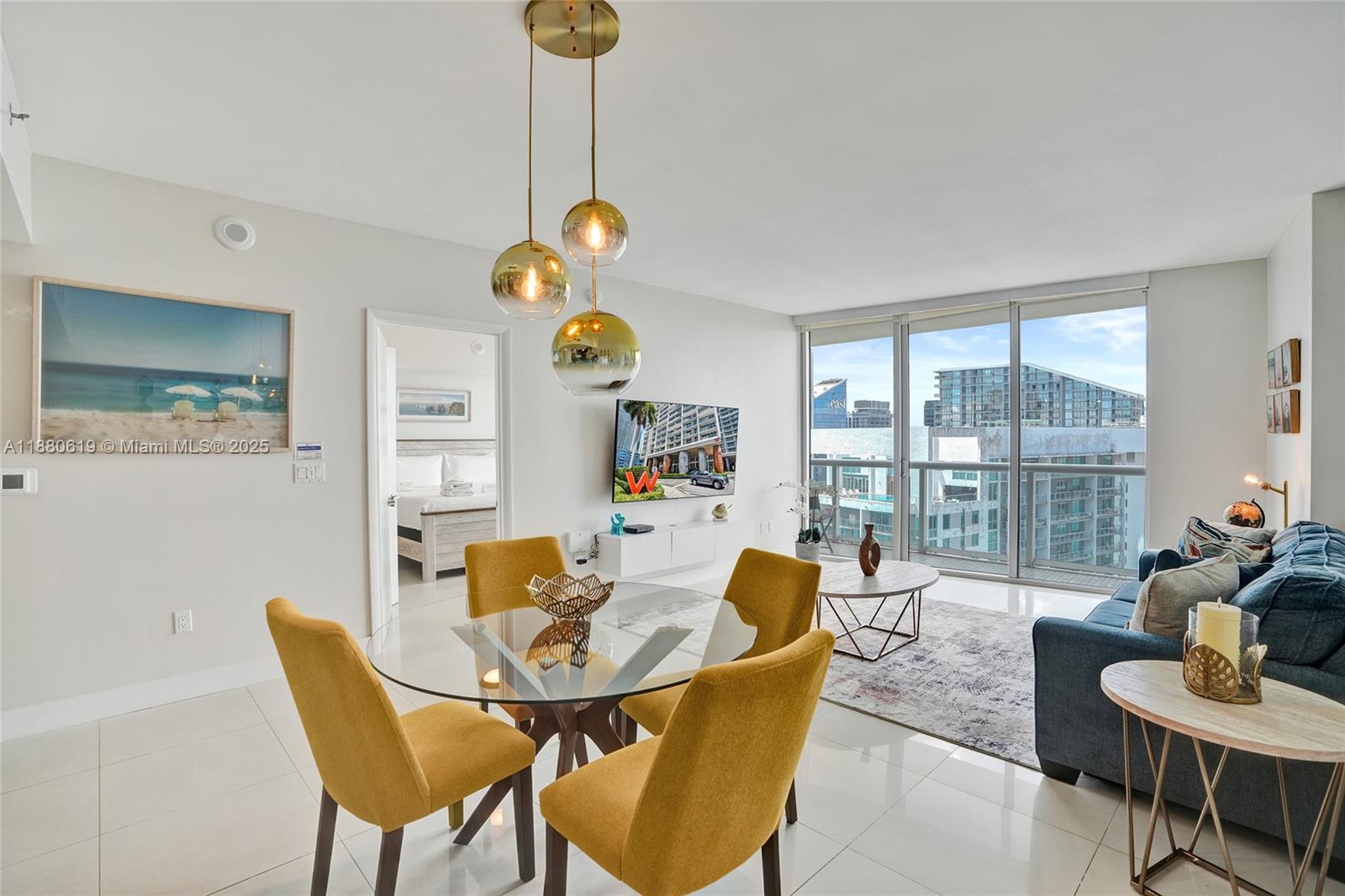 485 Brickell Avenue, Unit 4207 Miami, FL 33131 - Photo 6 of 41 a living room with furniture and a floor to ceiling window