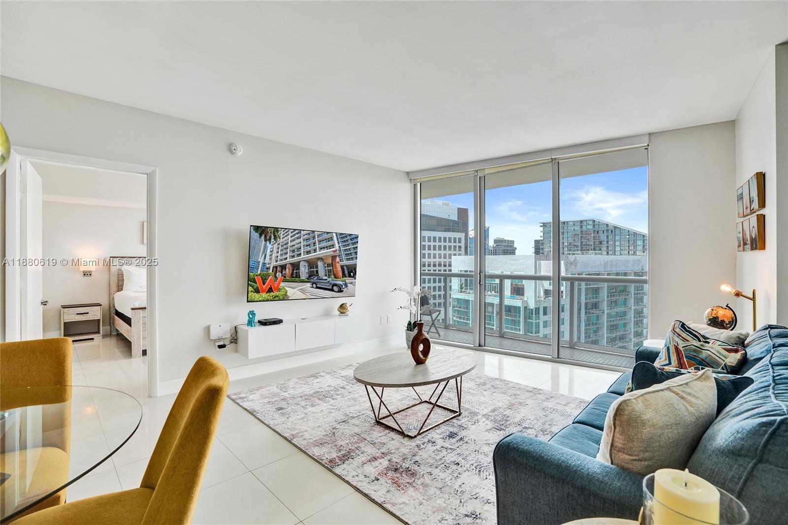 485 Brickell Avenue, Unit 4207 Miami, FL 33131 - Photo 7 of 41 a living room with furniture and a large window