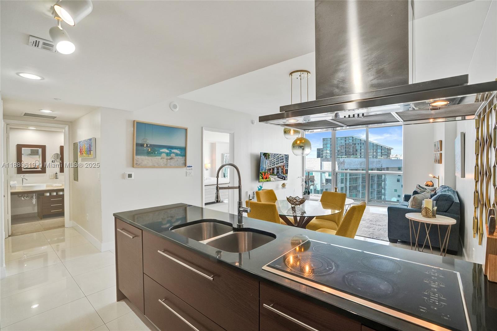 485 Brickell Avenue, Unit 4207 Miami, FL 33131 - Photo 10 of 41 a kitchen with a sink and living room view