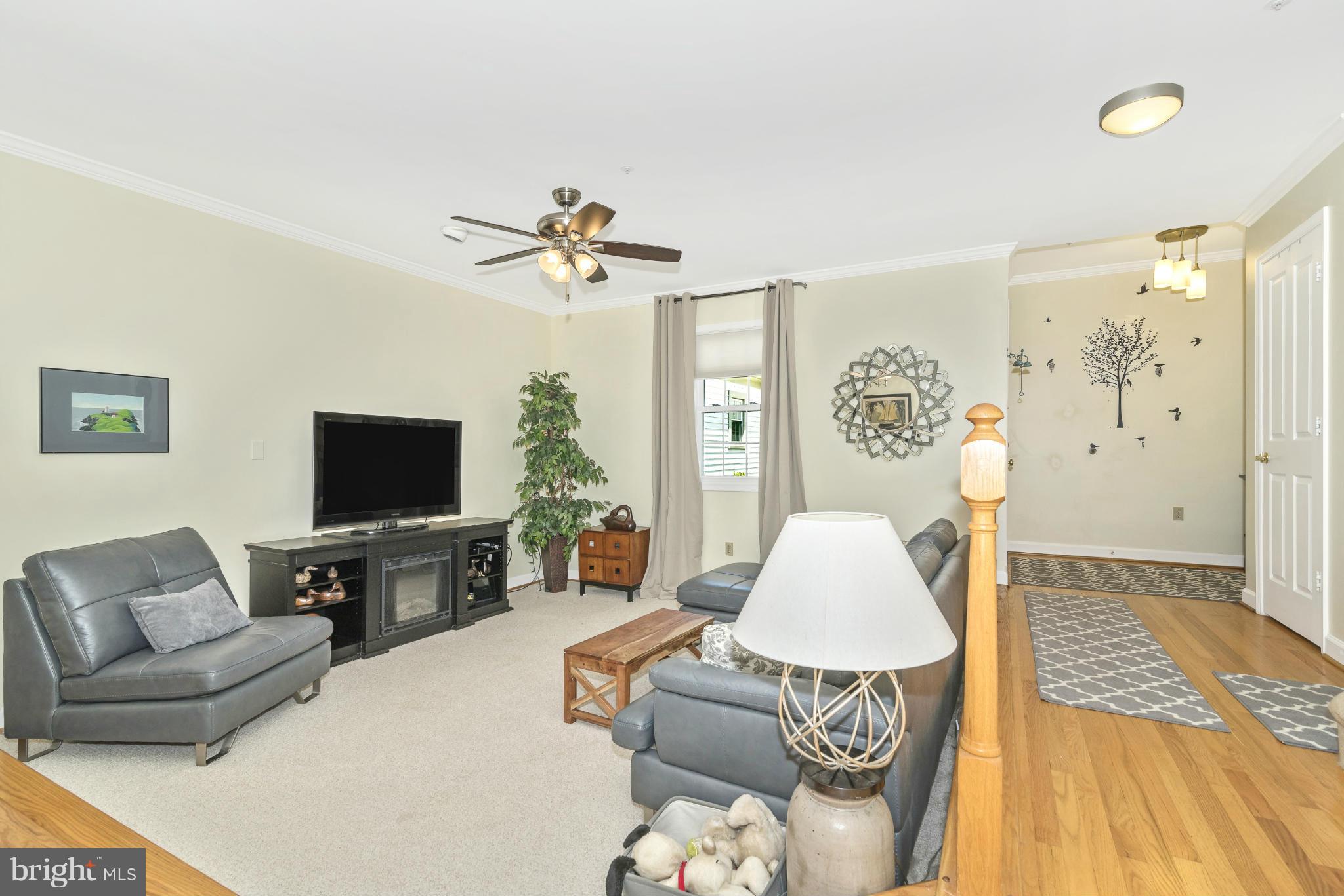 2443 Bear Den Road Frederick, MD 21701 - Photo 6 of 30 a living room with furniture and a flat screen tv