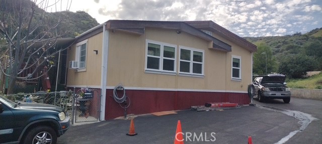 a view of a car park in front of house