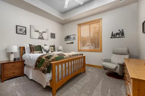 a bedroom with a bed and a couch