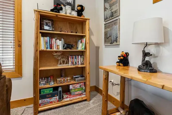 a kitchen with stainless steel appliances granite countertop a refrigerator a stove and a sink with wooden floors