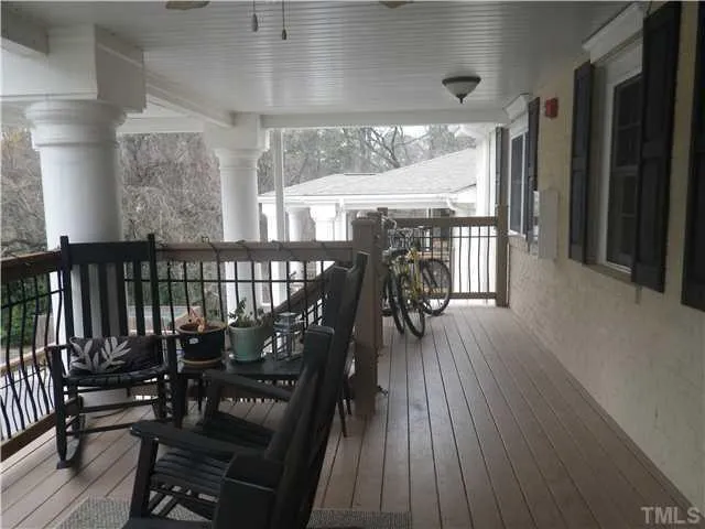 an outdoor space with wooden floor