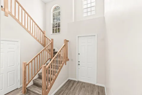a view of staircase with wooden floor and staircase