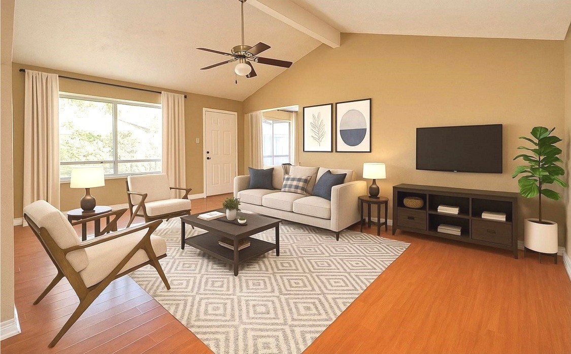 15829 Ridgeroe Lane Houston, TX 77053 - Photo 3 of 15 a living room with furniture a flat screen tv and a large window
