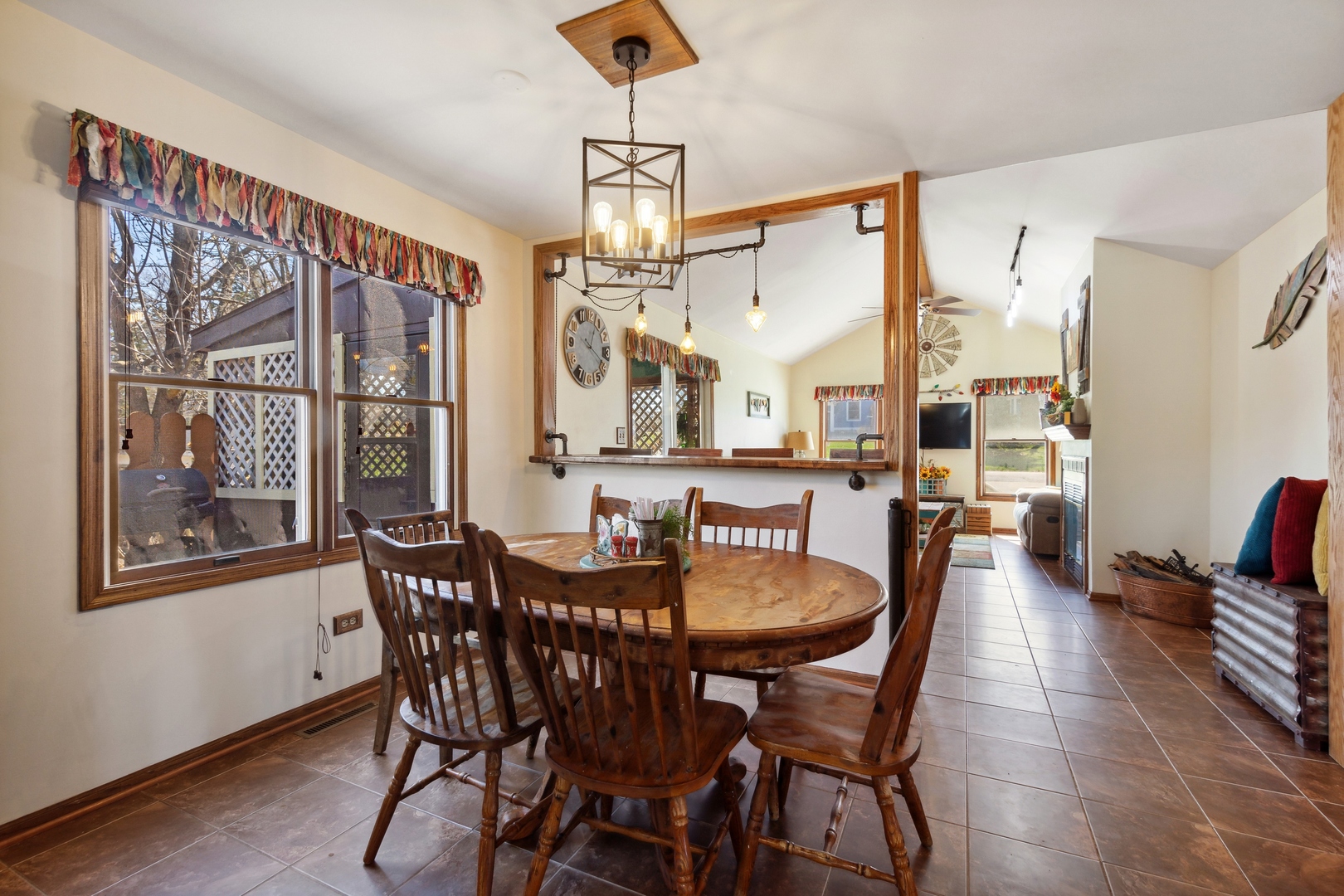 1040 North Cedar Road New Lenox, IL 60451 - Photo 12 of 37 a dining room with furniture a chandelier and wooden floor