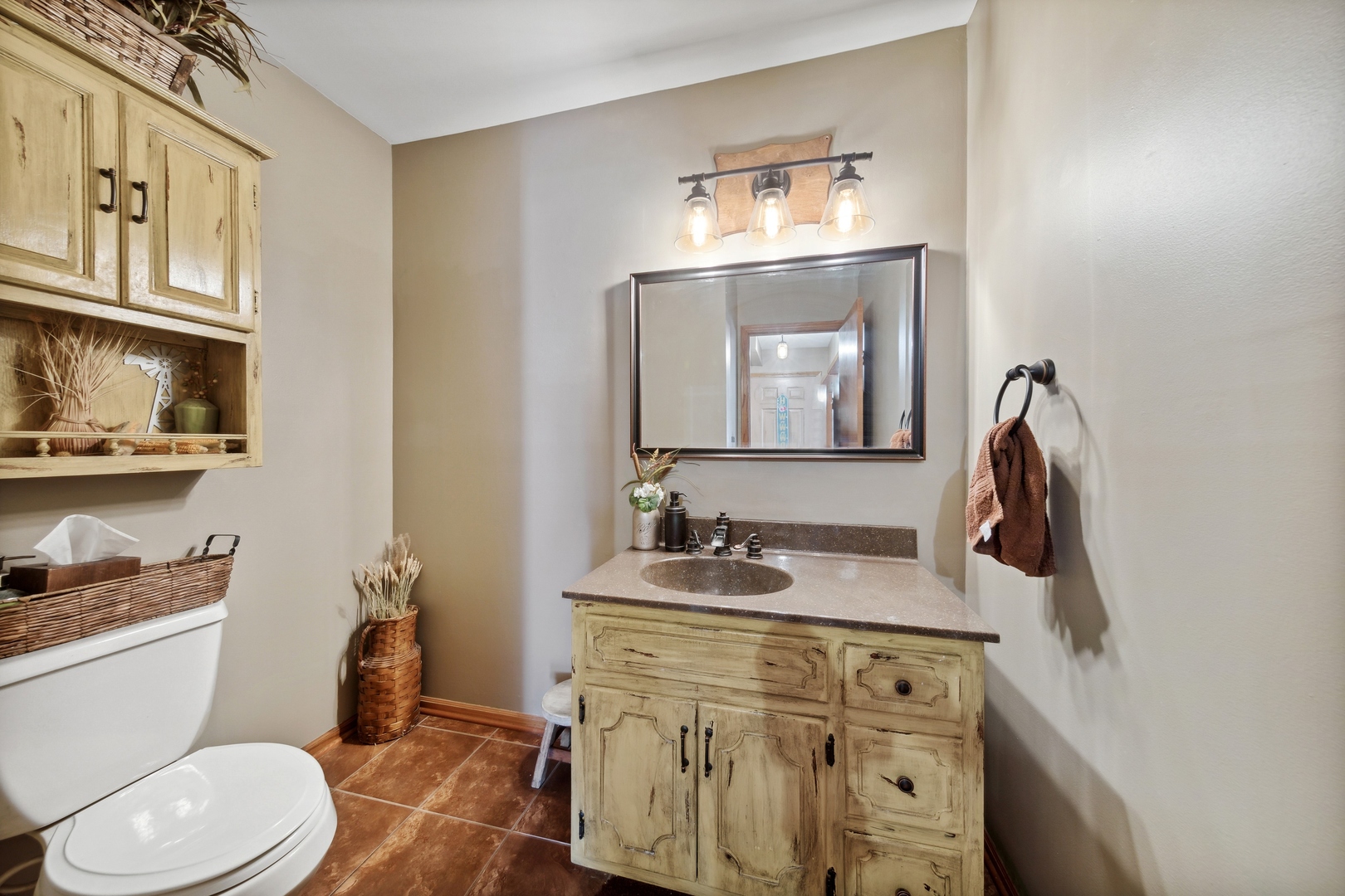 1040 North Cedar Road New Lenox, IL 60451 - Photo 13 of 37 a bathroom with a toilet sink and mirror