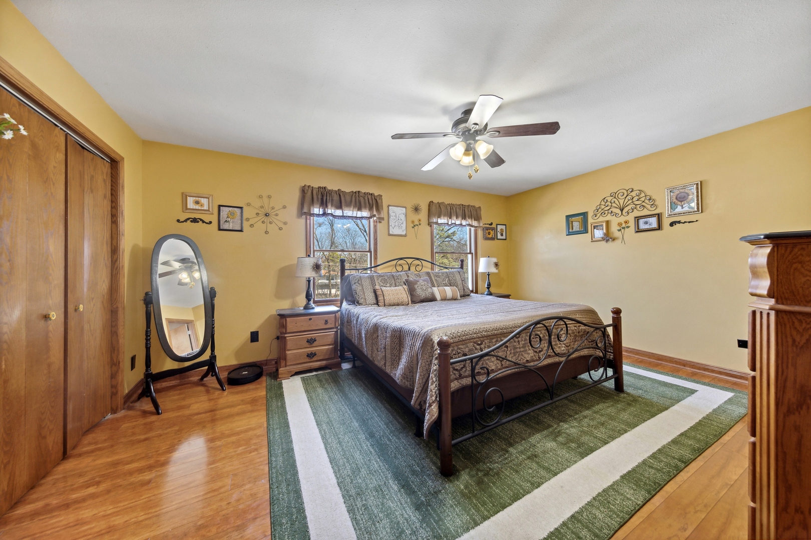 1040 North Cedar Road New Lenox, IL 60451 - Photo 18 of 37 a bedroom with a bed a dresser with wooden floor