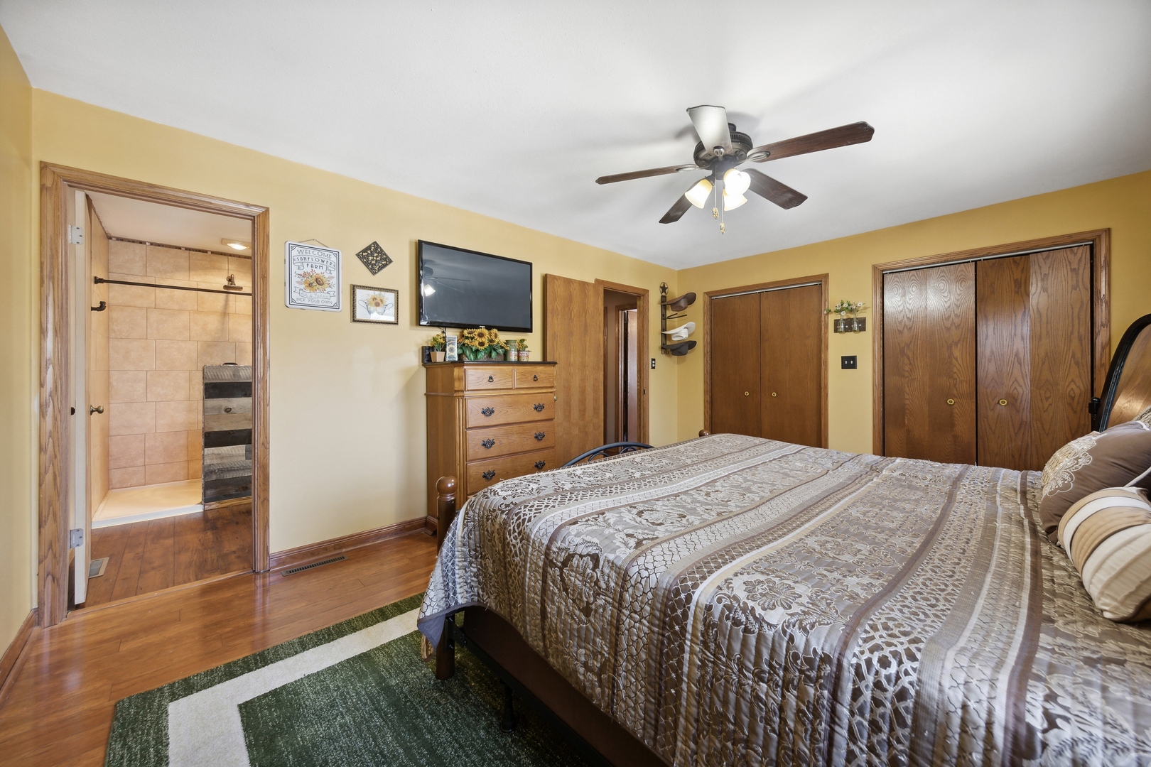1040 North Cedar Road New Lenox, IL 60451 - Photo 19 of 37 a bedroom with a bed and a television