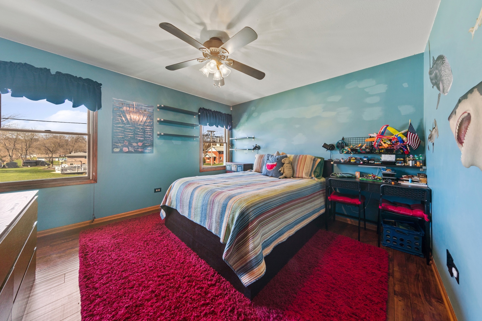 1040 North Cedar Road New Lenox, IL 60451 - Photo 22 of 37 a bedroom with a bed and a chandelier