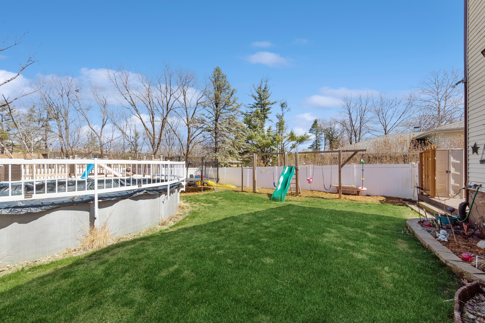 1040 North Cedar Road New Lenox, IL 60451 - Photo 27 of 37 a view of a lake with a house in the background