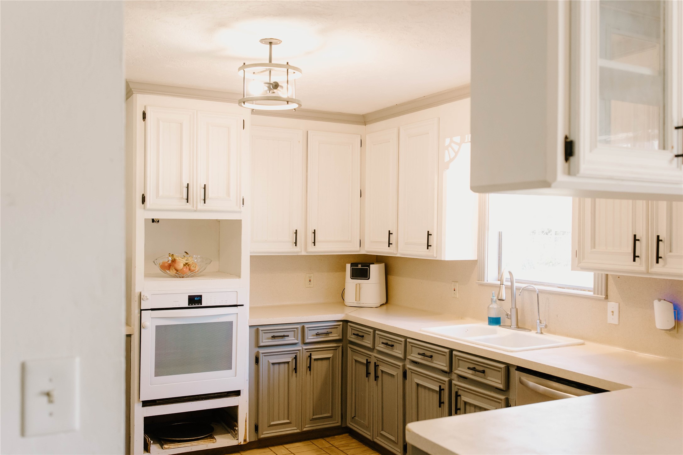 16120 Hartman Road Magnolia, TX 77355 - Photo 12 of 41 a kitchen with a sink dishwasher and white cabinets
