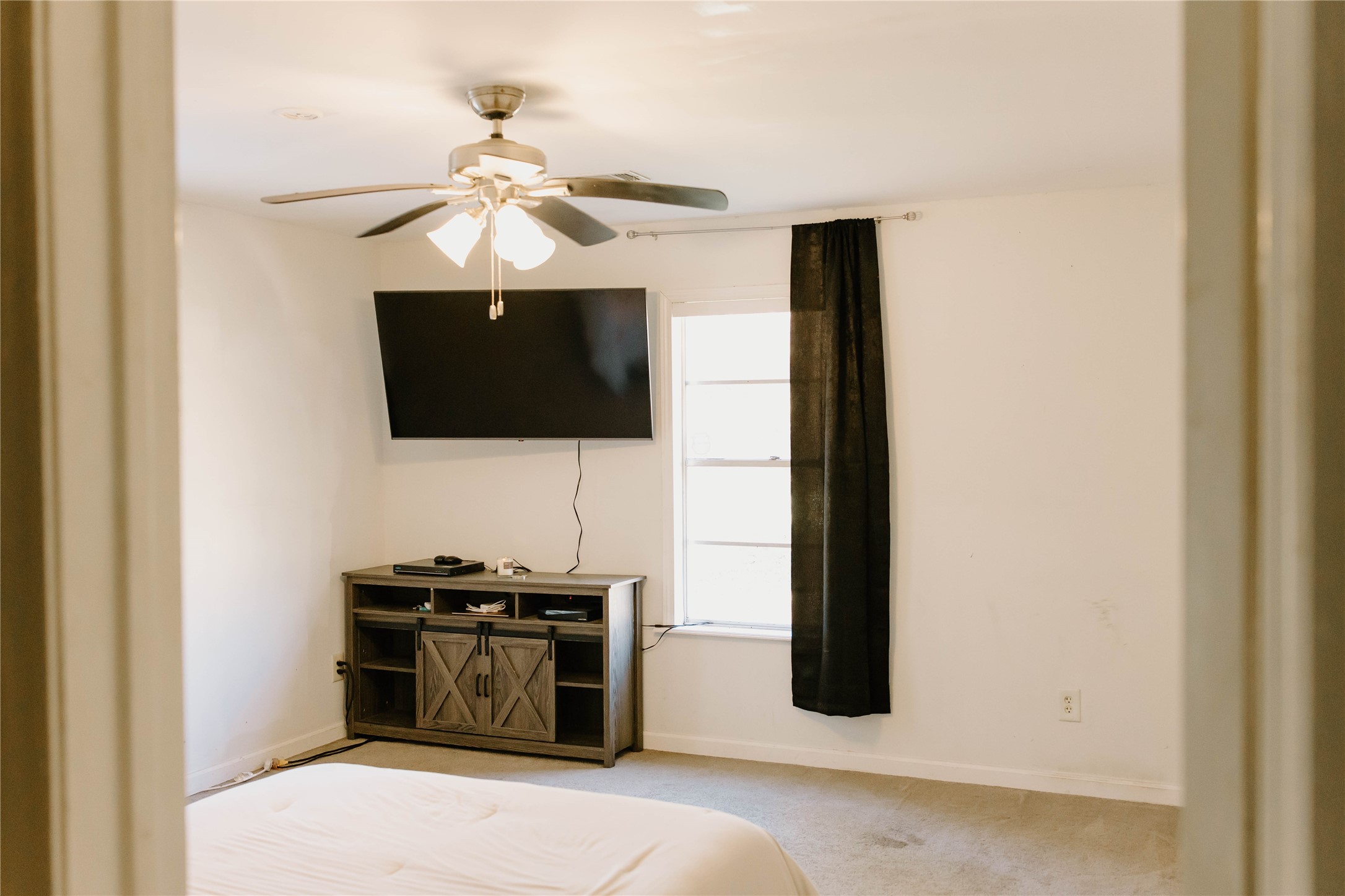 16120 Hartman Road Magnolia, TX 77355 - Photo 16 of 41 a kitchen with a stove and a microwave