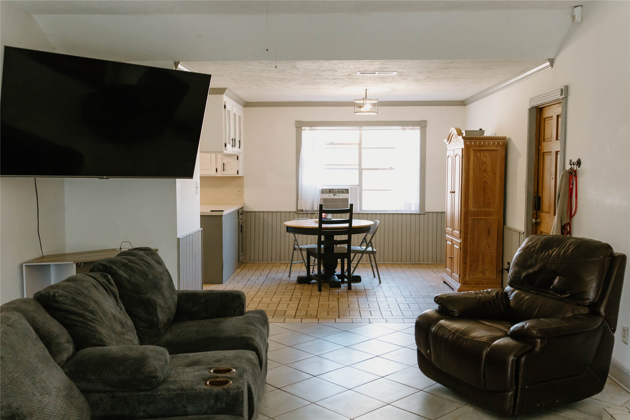 16120 Hartman Road Magnolia, TX 77355 - Photo 8 of 41 a living room with furniture and a flat screen tv