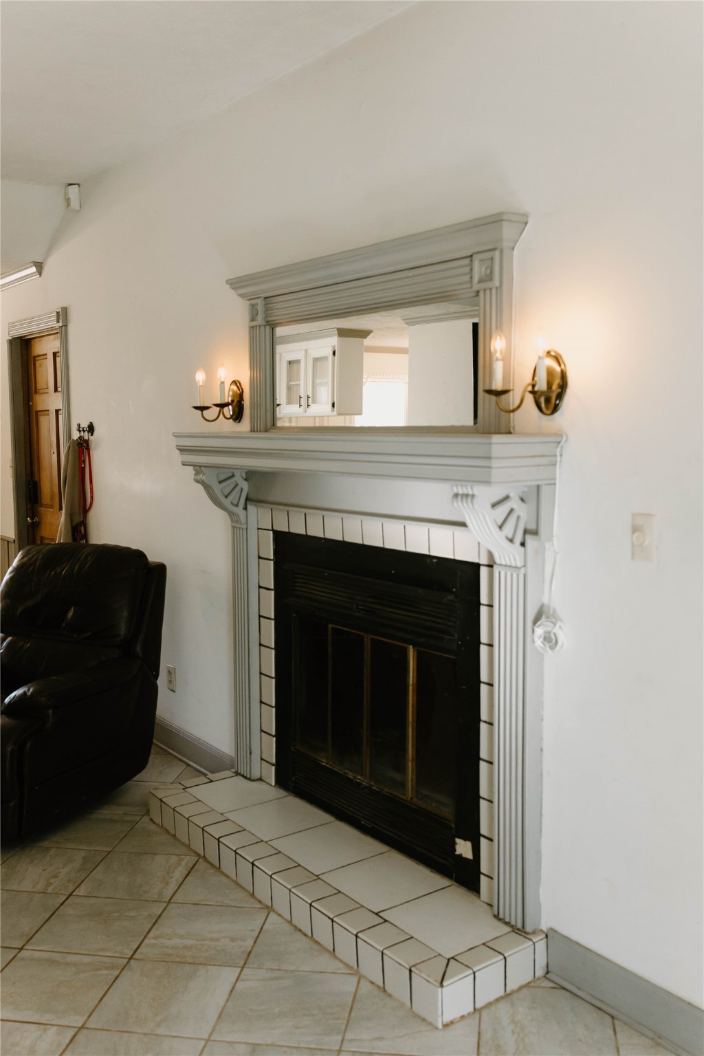 16120 Hartman Road Magnolia, TX 77355 - Photo 9 of 41 a living room with a fireplace and a stove top oven