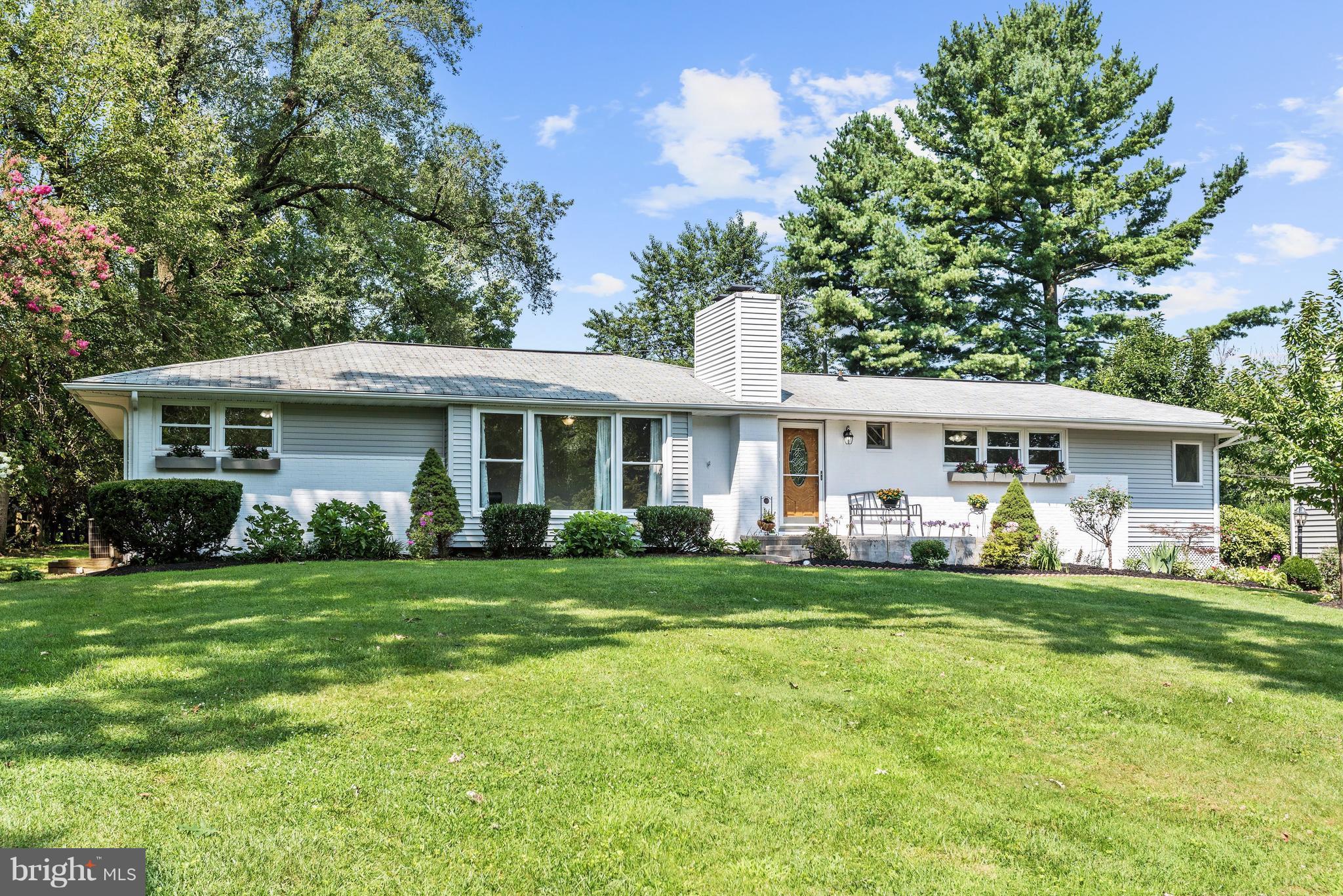 3618 Macalpine Road Ellicott City, MD 21042 - Photo 1 of 30 a front view of a house with a garden