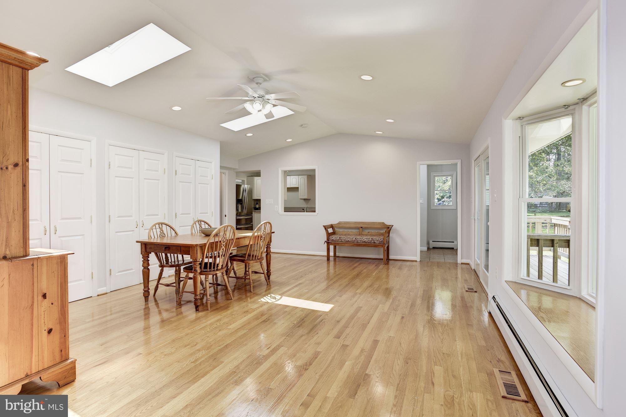 3618 Macalpine Road Ellicott City, MD 21042 - Photo 11 of 30 a view of a dining room with furniture window and wooden floor