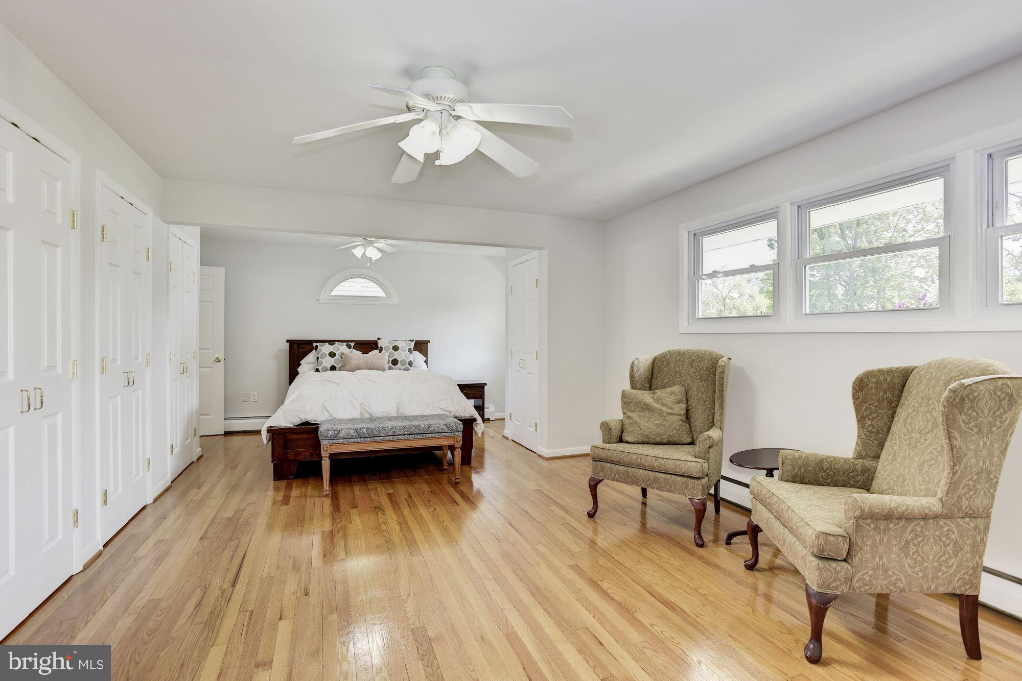 3618 Macalpine Road Ellicott City, MD 21042 - Photo 13 of 30 a bedroom with a bed and wooden floor