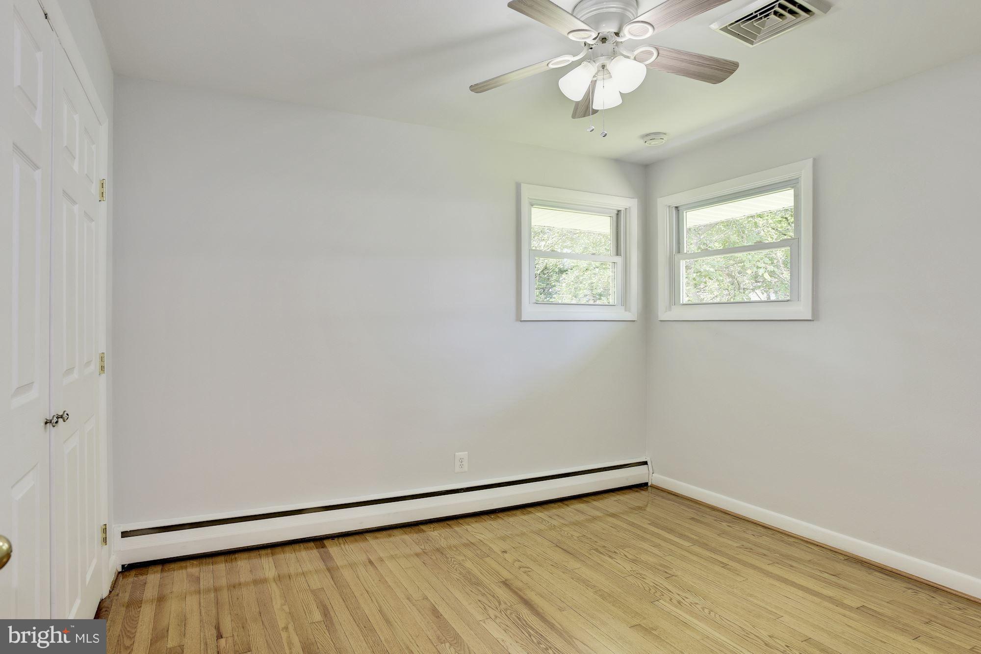 3618 Macalpine Road Ellicott City, MD 21042 - Photo 20 of 30 wooden floor in an empty room with a window