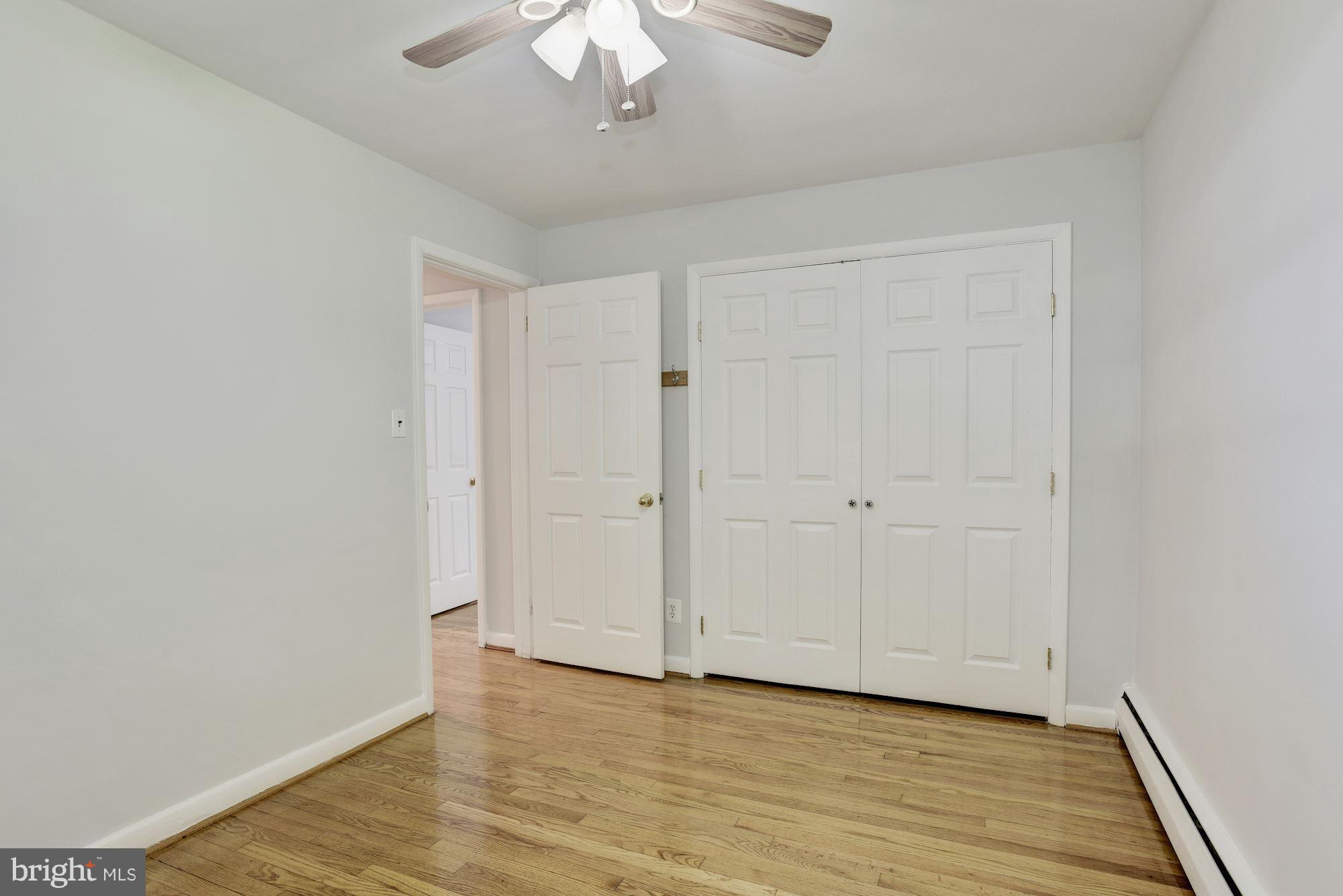 3618 Macalpine Road Ellicott City, MD 21042 - Photo 21 of 30 a view of an empty room with wooden floor