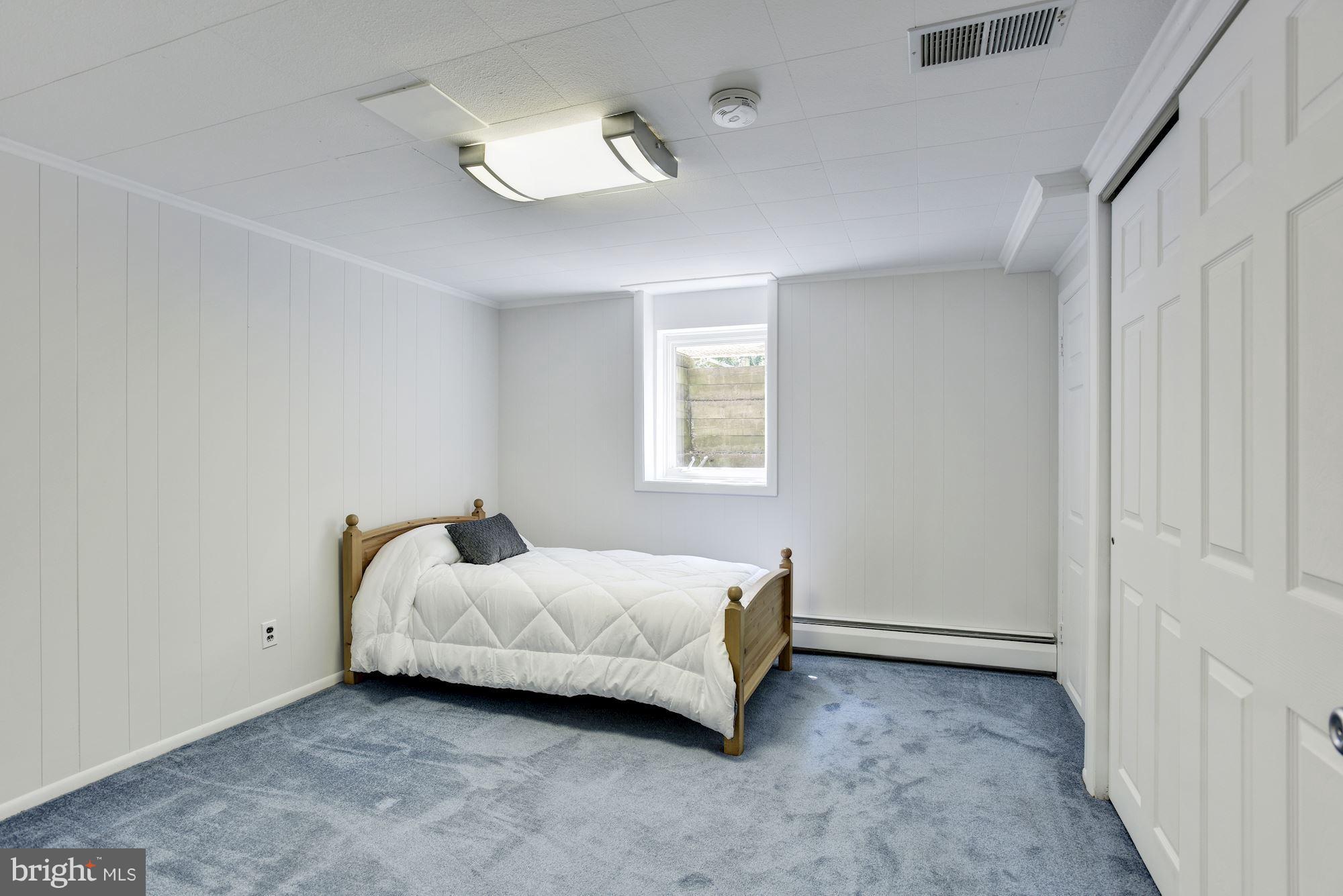 3618 Macalpine Road Ellicott City, MD 21042 - Photo 26 of 30 a spacious bedroom with a bed and a window
