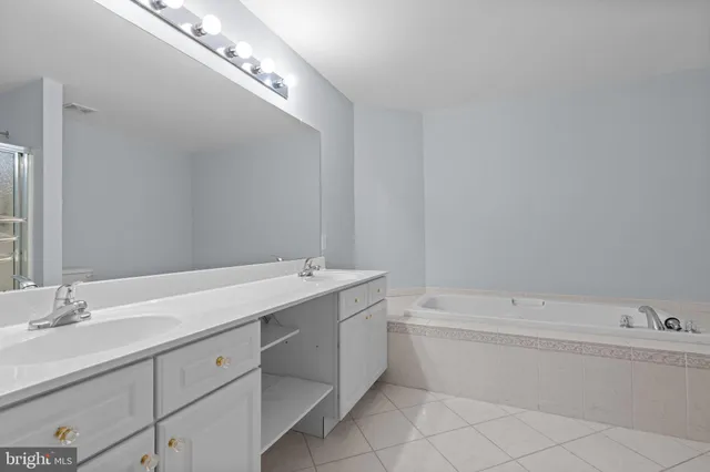 a bathroom with a bathtub and a sink