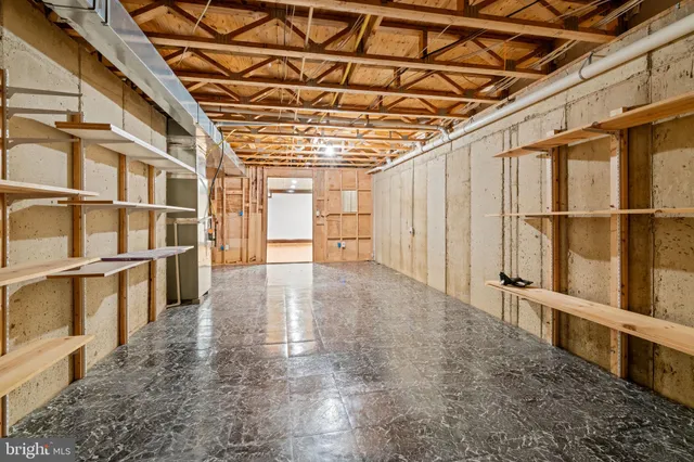 a view of an empty room with wooden walls