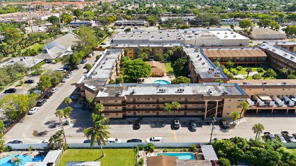 4161 Northwest 26th Street, Unit 105 Lauderhill, FL 33313 - Photo 1 of 26 an aerial view of a house with a swimming pool and outdoor seating