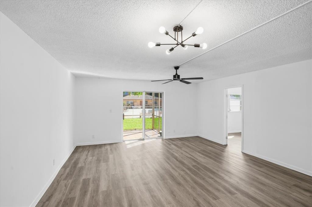 4161 Northwest 26th Street, Unit 105 Lauderhill, FL 33313 - Photo 14 of 26 wooden floor in an empty room with a window