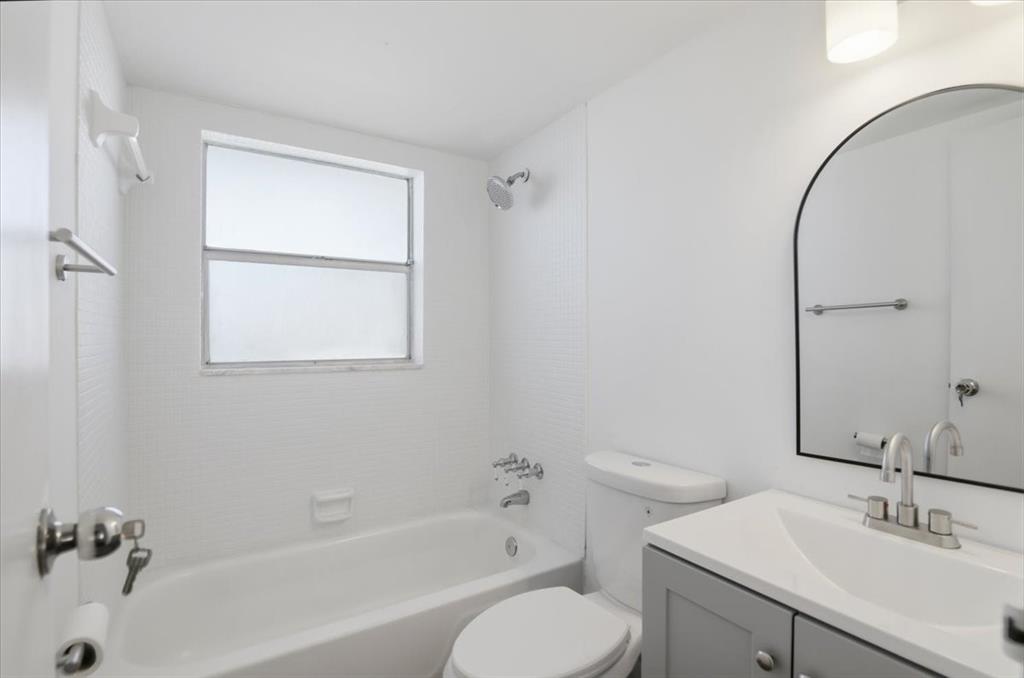 4161 Northwest 26th Street, Unit 105 Lauderhill, FL 33313 - Photo 18 of 26 a bathroom with a sink toilet and shower