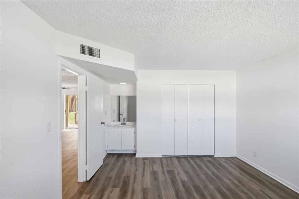4161 Northwest 26th Street, Unit 105 Lauderhill, FL 33313 - Photo 20 of 26 an empty room with closet and wooden floor