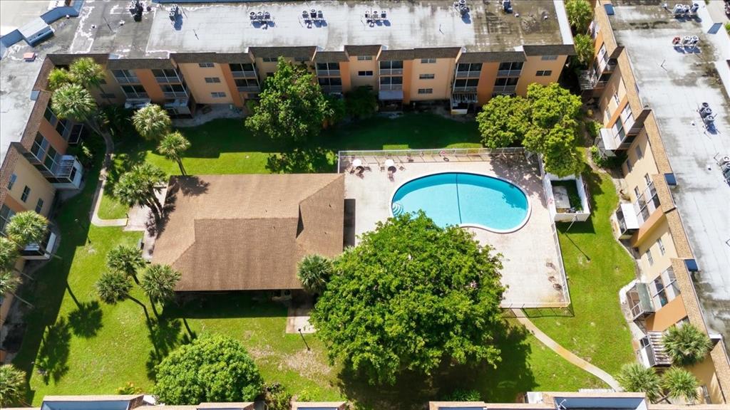 4161 Northwest 26th Street, Unit 105 Lauderhill, FL 33313 - Photo 3 of 26 an aerial view of multiple houses with yard