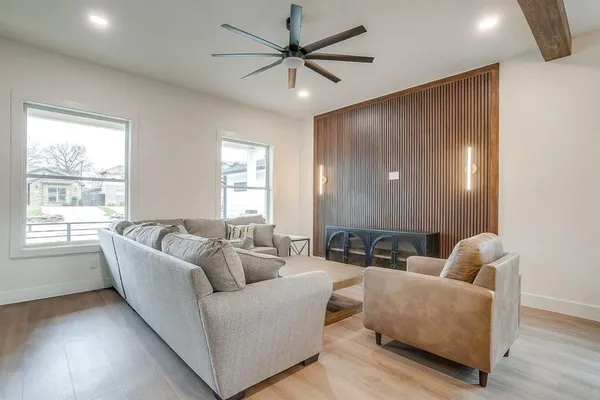 a living room with furniture and a large window