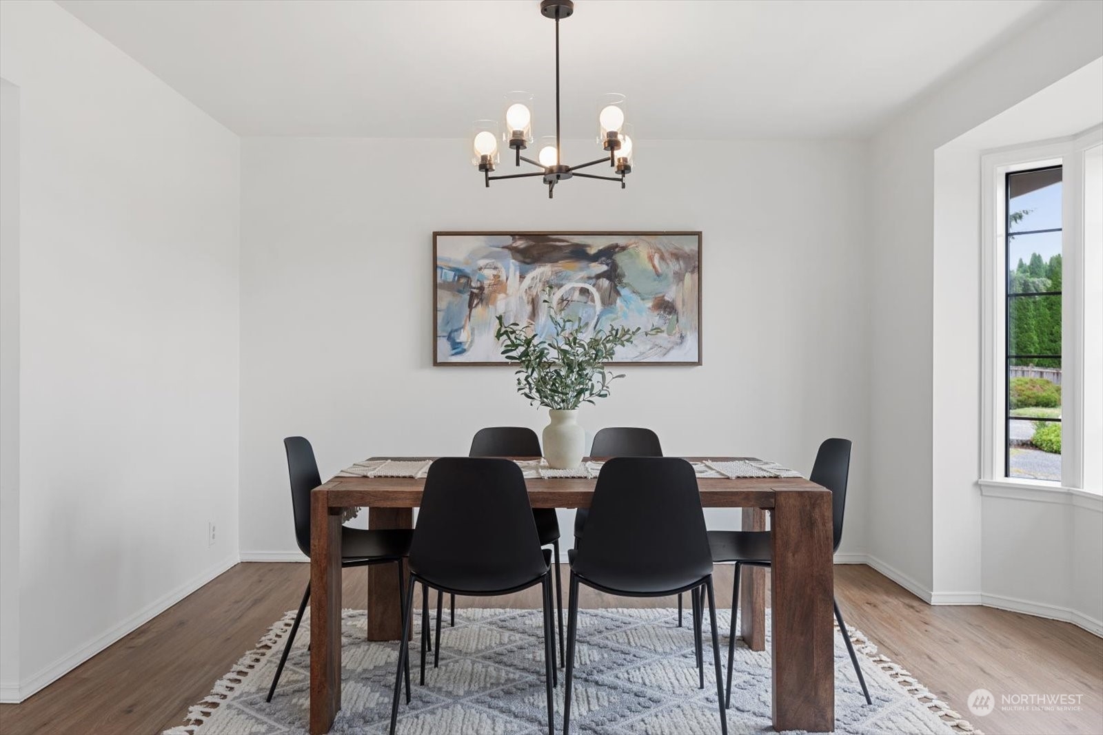 2480 215th Place Southwest Brier, WA 98036 - Photo 11 of 40 a view of a dining room with furniture wooden floor and a chandelier