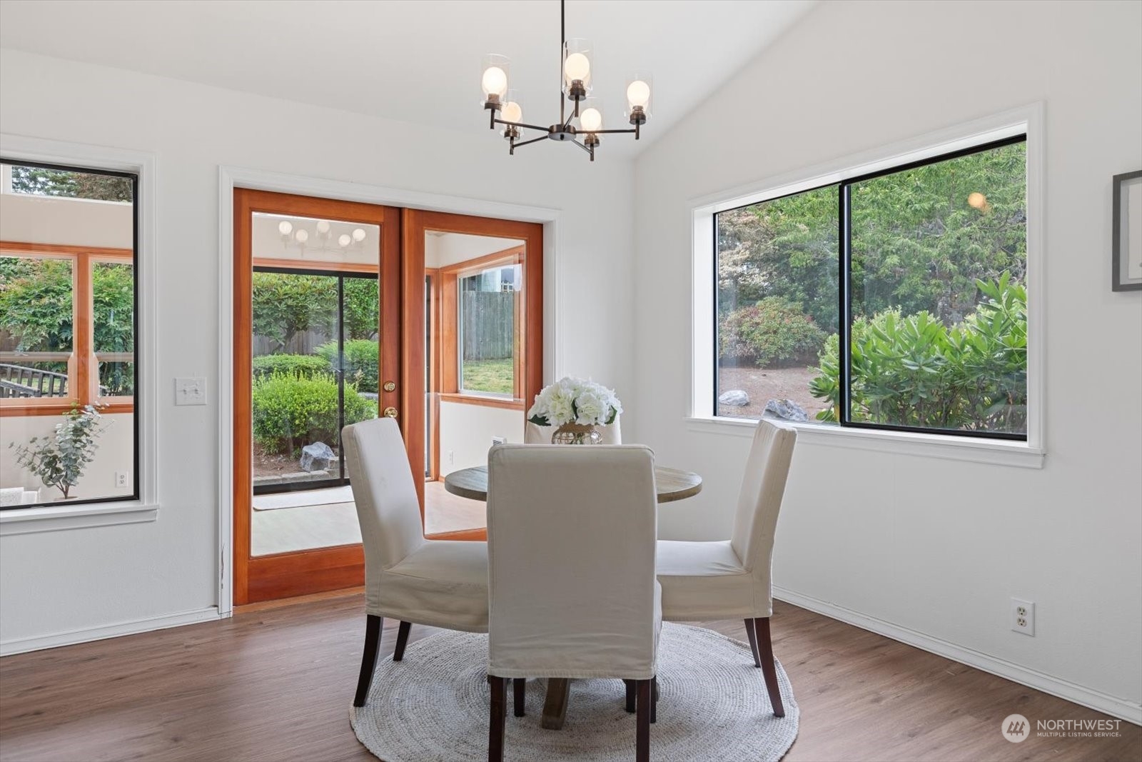 2480 215th Place Southwest Brier, WA 98036 - Photo 17 of 40 a dining room with furniture a chandelier and wooden floor