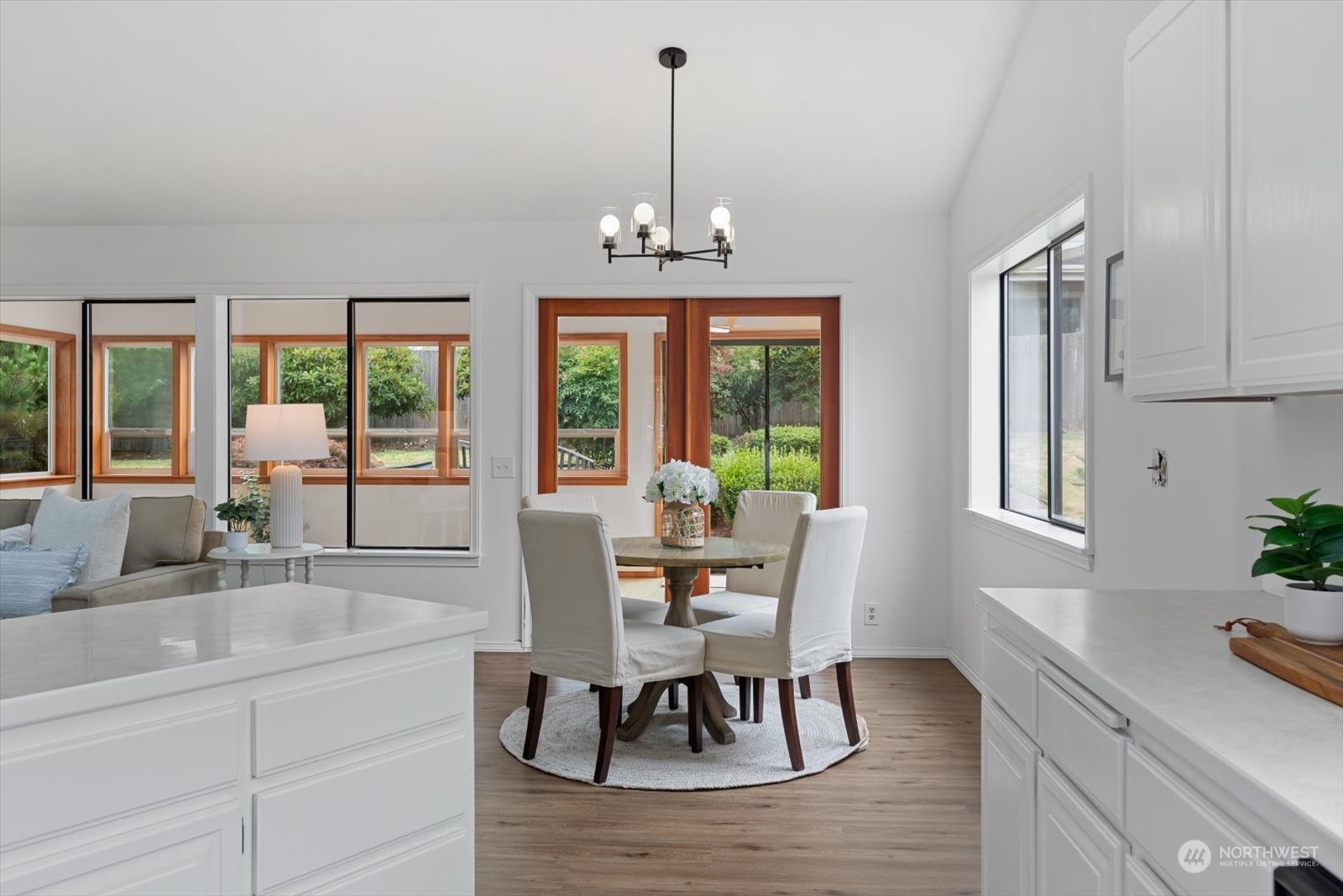 2480 215th Place Southwest Brier, WA 98036 - Photo 19 of 40 a dining room with furniture a chandelier and wooden floor