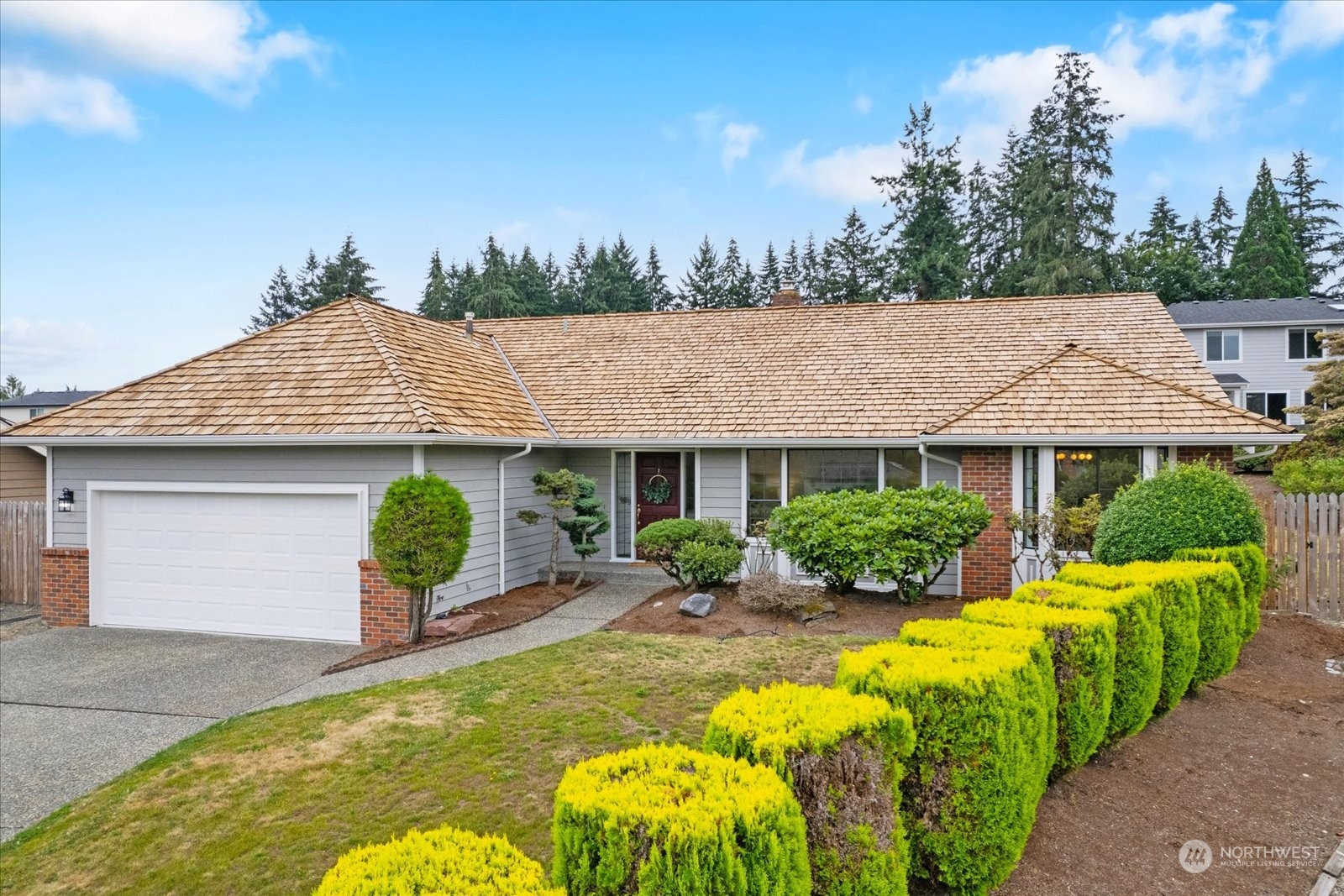 2480 215th Place Southwest Brier, WA 98036 - Photo 2 of 40 a view of a house with swimming pool and furniture