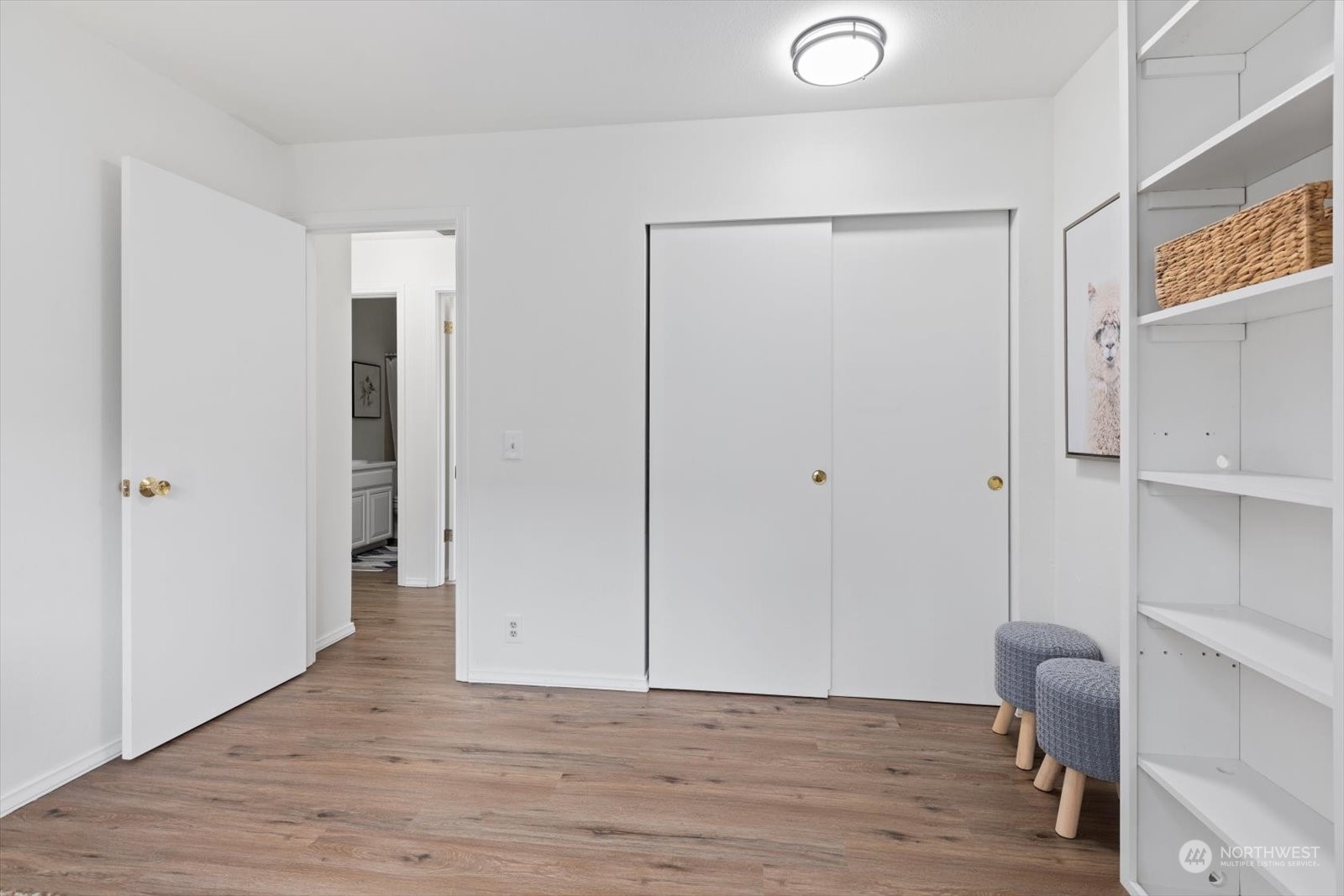 2480 215th Place Southwest Brier, WA 98036 - Photo 29 of 40 a view of a livingroom with wooden floor and closet