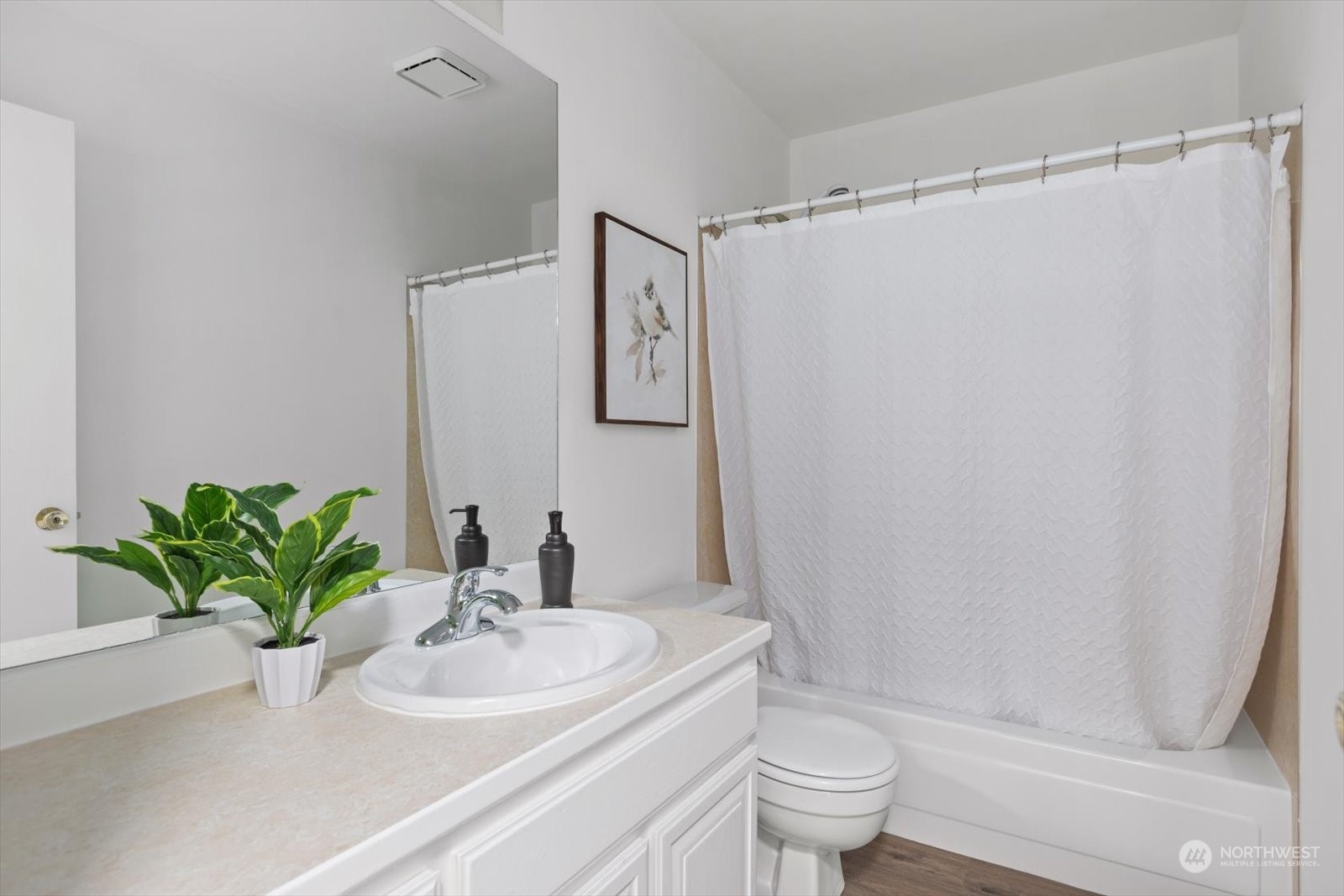 2480 215th Place Southwest Brier, WA 98036 - Photo 30 of 40 a bathroom with a sink a toilet and a mirror