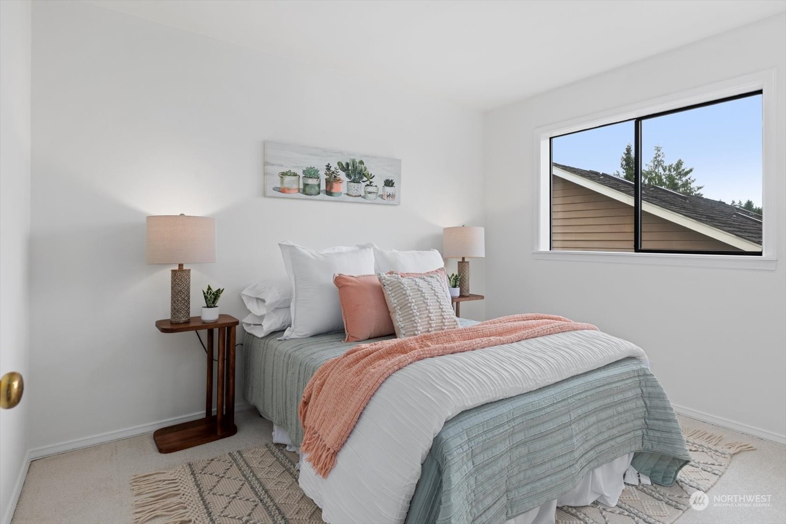 2480 215th Place Southwest Brier, WA 98036 - Photo 31 of 40 a bed room with a bed and a painting on the wall