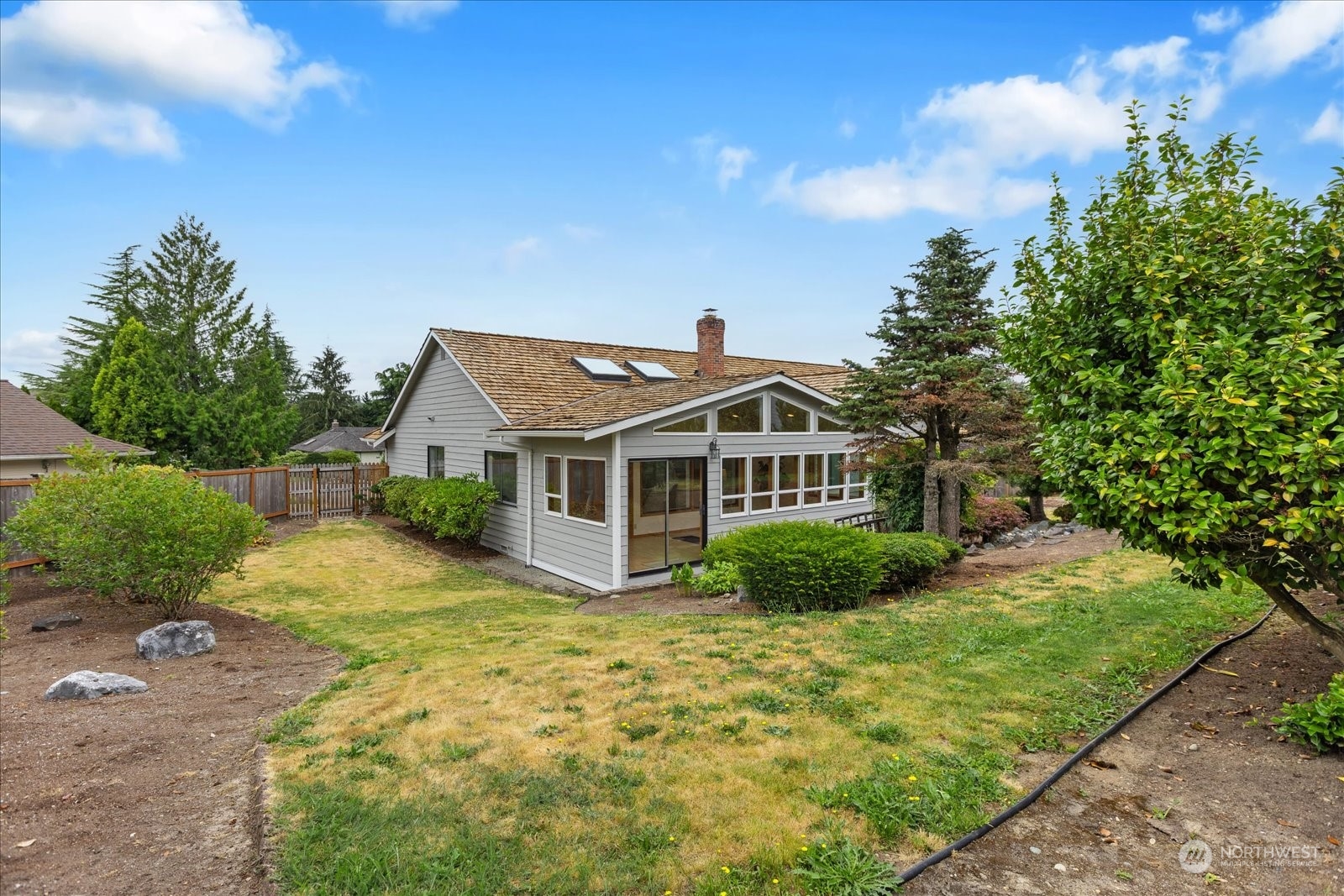 2480 215th Place Southwest Brier, WA 98036 - Photo 34 of 40 a front view of a house with a yard