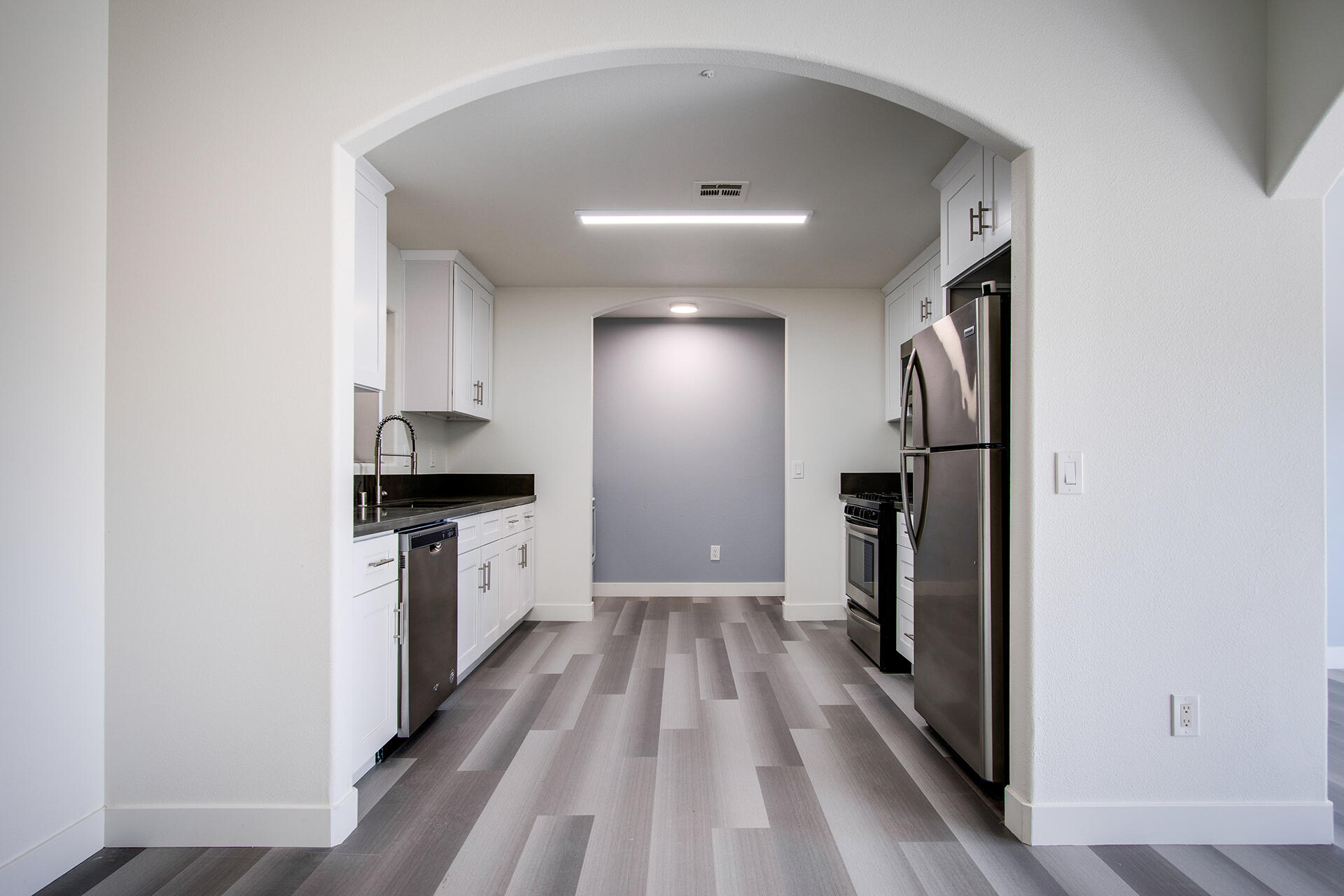 61786 Desert Air Road Joshua Tree, CA 92252 - Photo 15 of 54 a view of kitchen with refrigerator microwave and stove top oven