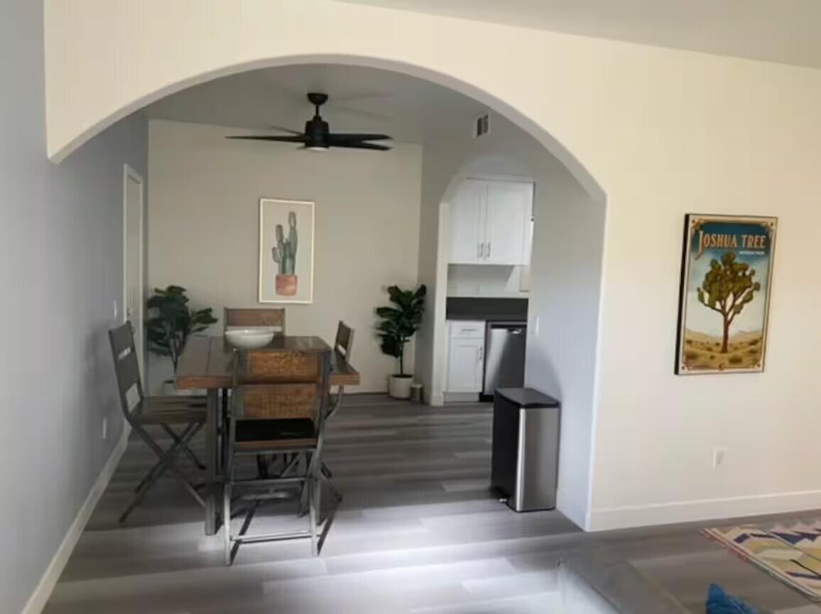 61786 Desert Air Road Joshua Tree, CA 92252 - Photo 17 of 54 a living room with furniture and a window