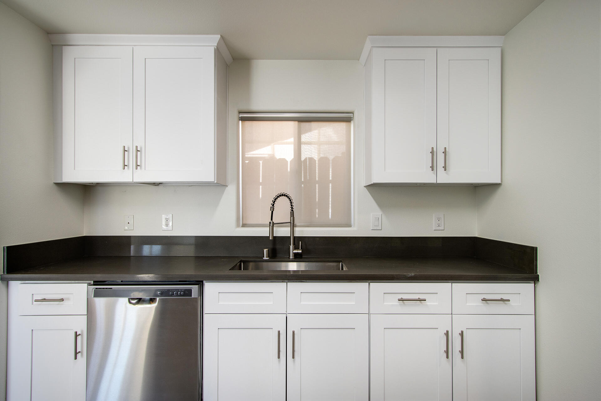 61786 Desert Air Road Joshua Tree, CA 92252 - Photo 19 of 54 a close view of a stove a microwave and cabinets