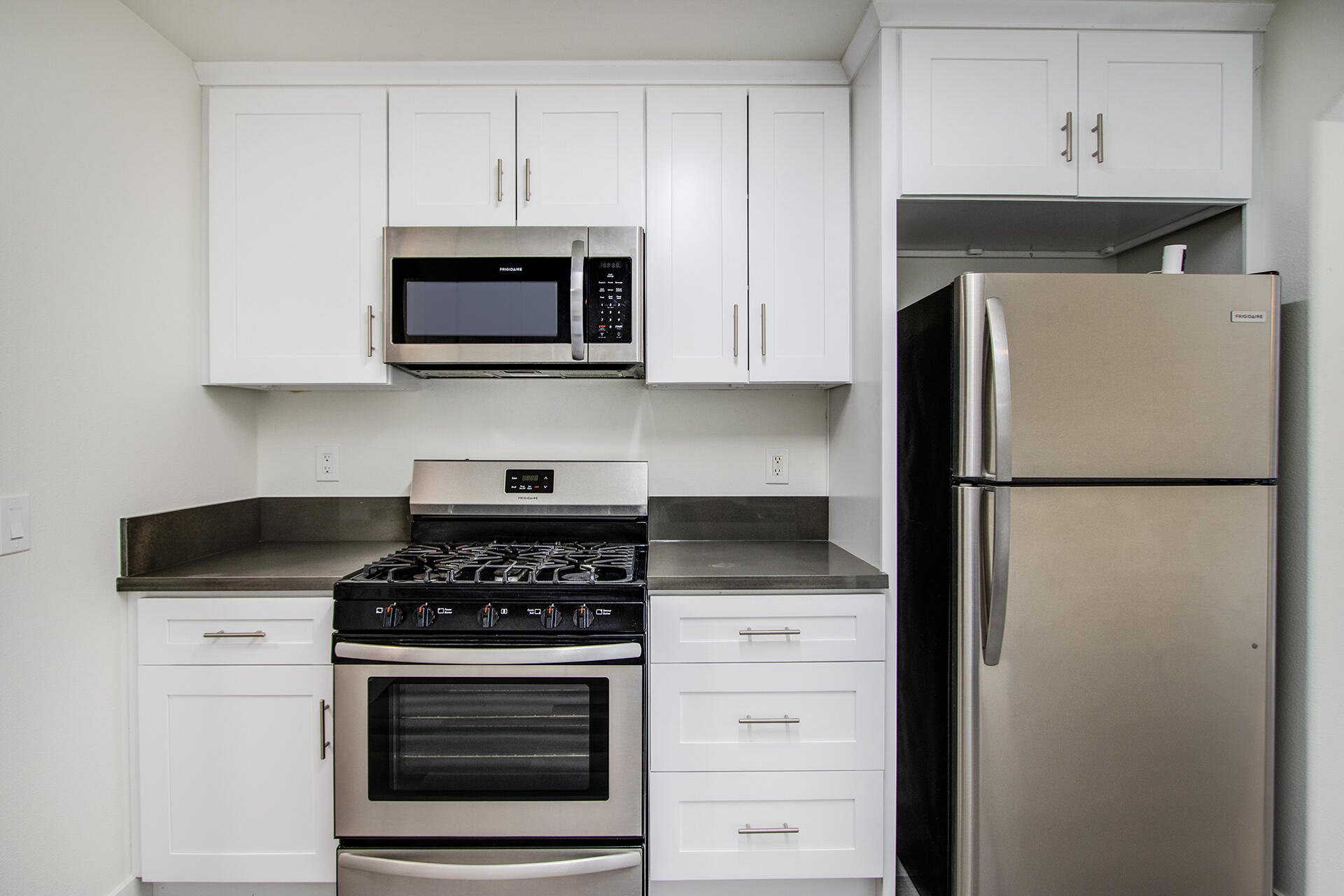 61786 Desert Air Road Joshua Tree, CA 92252 - Photo 20 of 54 a kitchen with stainless steel appliances a stove and a microwave